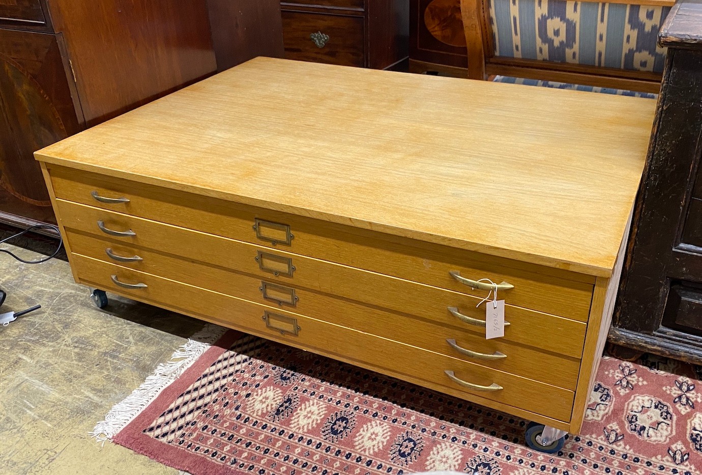 A mid century oak four draw plan chest top section, now on castors, width 130cm, depth 94cm, height 47cm *Please note the sale commences at 9am.